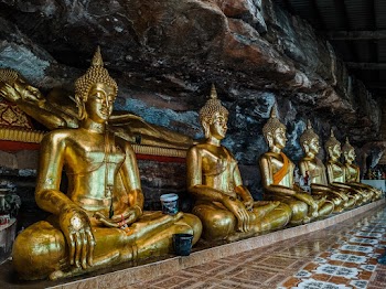 Gautama Buddha Statuettes Inside Brown and White Room