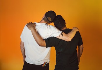 Gay Couple Embrace And Celebrate Pride