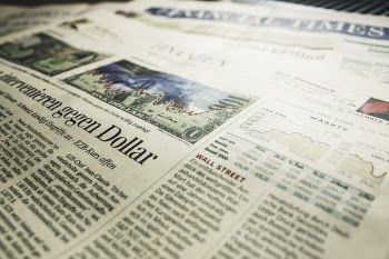 Gegen Dollar Newspaper Article