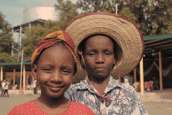 Girl and Boy in Red and Gray Tops