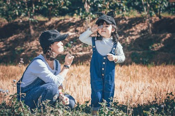 Girl and Woman in Field
