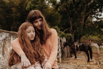 Girl and Woman Wearing Pink Sweatshirts