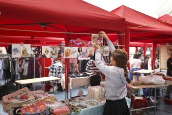 Girl Arranging Displays For Sale