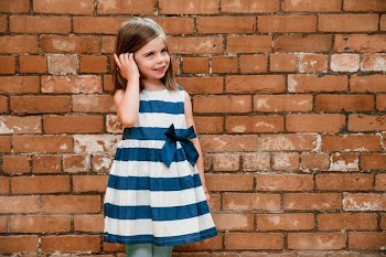 Girl By Brick Wall