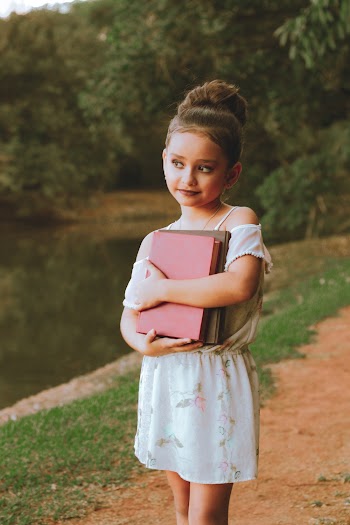 Girl Carrying Books