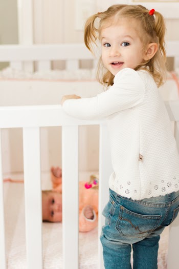 Girl Climbing on Crib