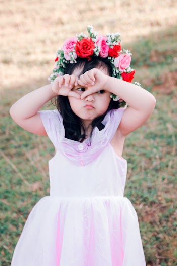 Girl Covering Her Face