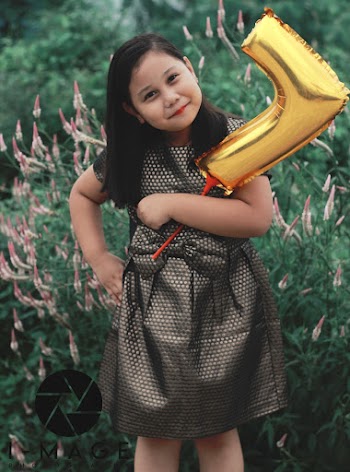 Girl Holding A Balloon