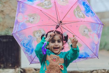 Girl Holding an Umbrella