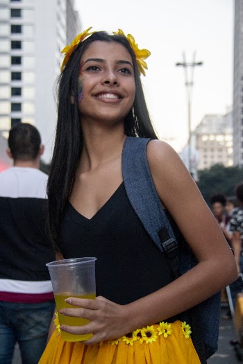 Girl Holding Clear Plastic Cup Wearing Black V-neck Top 