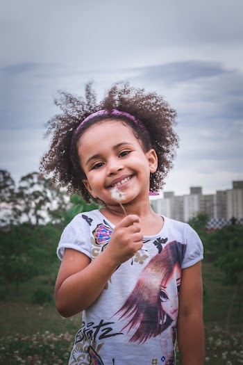 Girl Holding Dandelion Flower