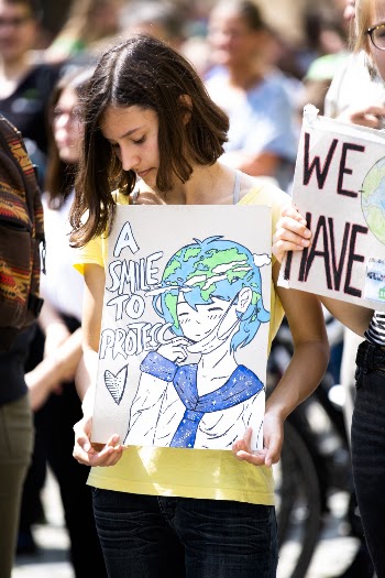 Girl Holding Earth Poster