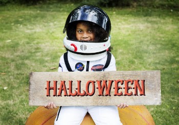 Girl Holding Halloween Decor