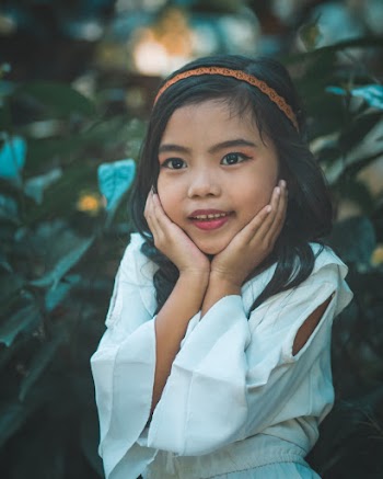 Girl Holding Her Face