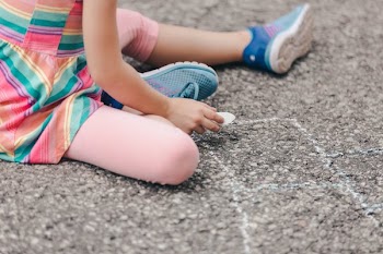 Girl Holding Sidewalk Chalk