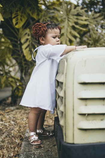 Girl Holding Yellow Machine