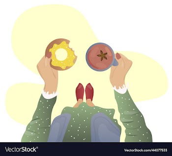 girl holds a cup and a donut in her hands warm