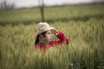 Girl in Red Hoodie Wearing Beige Sunhat