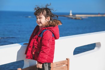 Girl In Red Parka Jacket