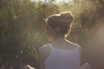 Girl in the rays of sun