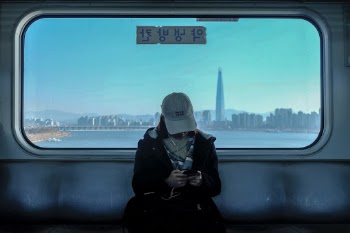 Girl in the train. Overlooking Gangnam.
