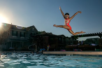 Girl Jumping On Swimming Pool