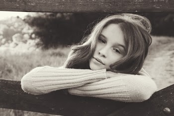 Girl Leaning on Wooden Fence