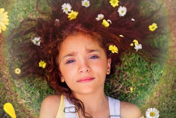 Girl Lying on Green Grass Field