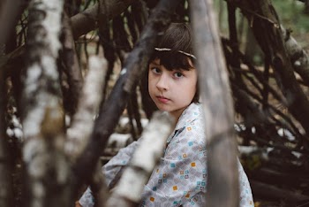 Girl on Brown Tree Branches