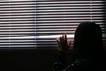 Girl Peaking Outside Window