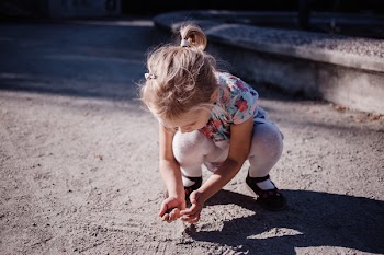 Girl playing with sand