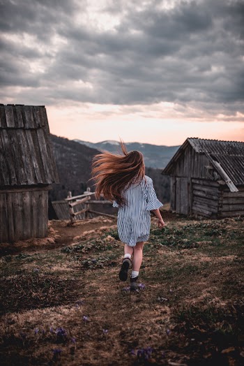 Girl Running on Brown and Green Field