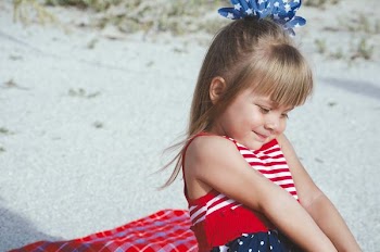 girl sitting on cloth