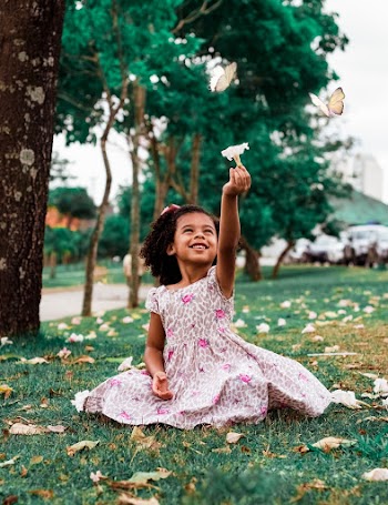 Girl Sitting On Grass