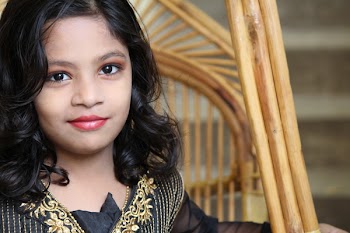 Girl Sitting on Rattan Chair