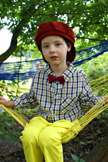 Girl Sitting on Yellow Hammock