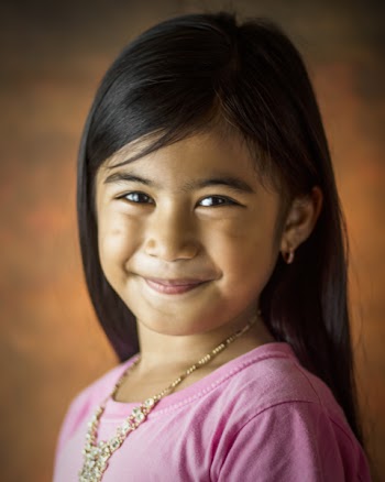 Girl Smiling While Wearing Pink Shirt