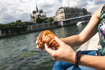 Girl snacking on croissant 