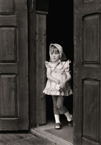 Girl Standing Beside Door