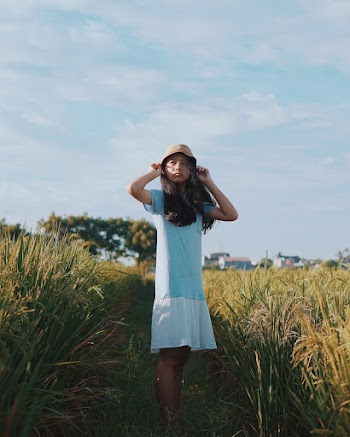 Girl Standing in Rice Field