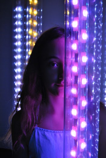 Girl Standing In the Middle Of Neon Lights