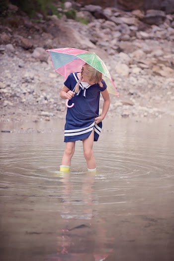 Girl Standing on Body of Water