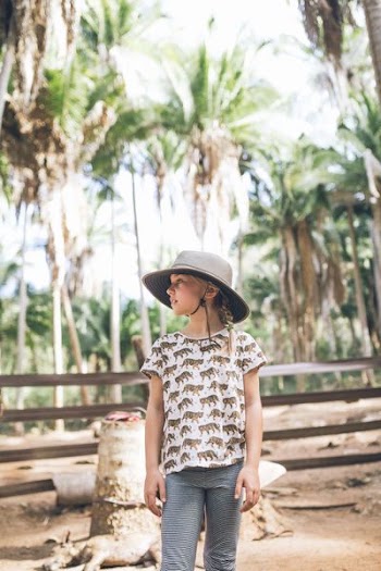 girl standing white looking on trees