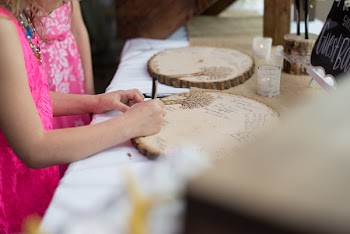 Girl Touching Brown Board on Table