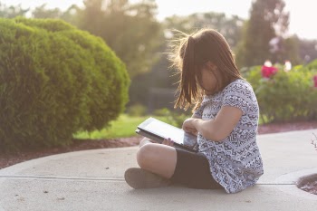 Girl Using Ipad Outdoors