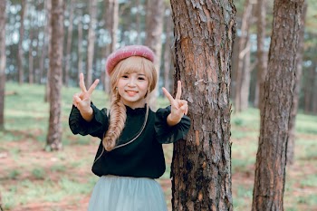 Girl Wearing Black Shirt Standing Near Tree