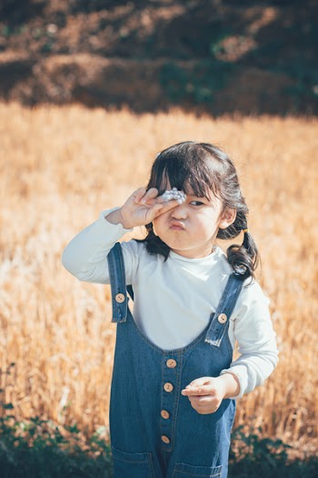Girl Wearing Blue Denim Dungarees Doing Pouty Lips