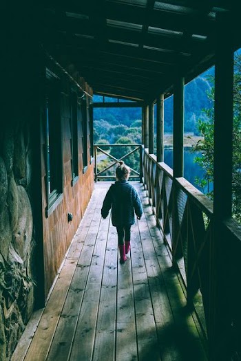 girl wearing blue jacket and pajama pants