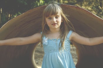 Girl Wearing Blue Sleeveless Dress