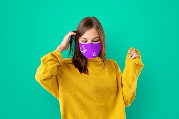 Girl wearing face mask to prevent Covid 19